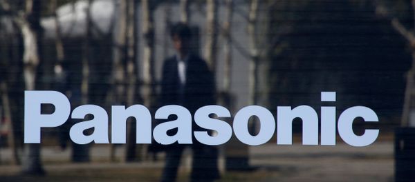 A man is reflected on Panasonic Corp's logo at Panasonic Center in Tokyo - Sputnik International