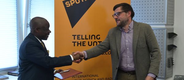 Sergei Kochetkov, Rossiya Segodnya First Deputy Editor-in-Chief, and Ernest Kabila Ilunga, Director General of RTNC. Sergei Kochetkov, Rossiya Segodnya First Deputy Editor-in-Chief, and Ernest Kabila Ilunga, Director General of RTNC. - Sputnik International