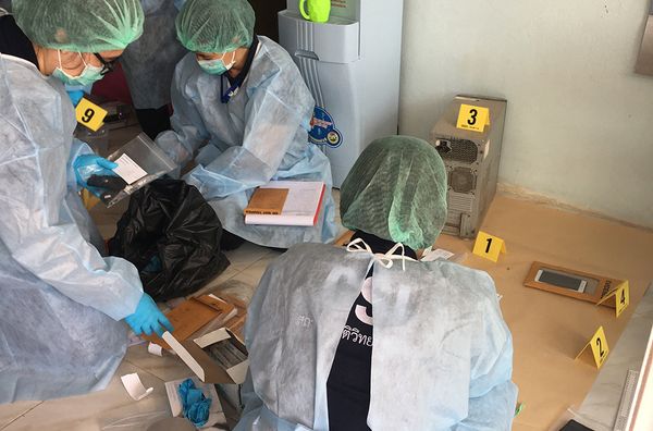 Officers collect evidence in the form of devices and other items from Salangam's home in Thailand.  - Sputnik International