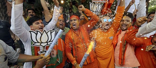 Bharatiya Janata Party (BJP) workers celebrate outside BJP headquarters in New Delhi India, Thursday, May 23, 2019. - Sputnik International