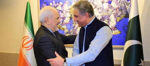 In this photo released by the Foreign Office, Pakistani Foreign Minister Shah Mehmood Qureshi, right, shakes hands with Iranian Foreign Minister Mohammad Javad Zarif at the Foreign Ministry in Islamabad, Pakistan, Friday, May 24, 2019 In this photo released by the Foreign Office, Pakistani Foreign Minister Shah Mehmood Qureshi, right, shakes hands with Iranian Foreign Minister Mohammad Javad Zarif at the Foreign Ministry in Islamabad, Pakistan, Friday, May 24, 2019 - Sputnik International