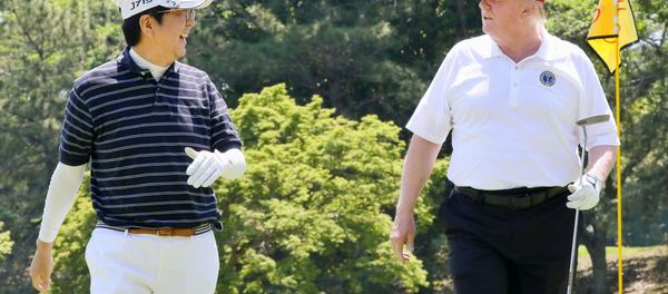 U.S. President Donald Trump talks with Japanese Prime Minister Shinzo Abe as they play golf at Mobara Country Club in Mobara, Chiba prefecture, Japan, in this photo released by Japan's Cabinet Public Relations Office via Kyodo May 26, 2019 U.S. President Donald Trump talks with Japanese Prime Minister Shinzo Abe as they play golf at Mobara Country Club in Mobara, Chiba prefecture, Japan, in this photo released by Japan's Cabinet Public Relations Office via Kyodo May 26, 2019 - Sputnik International