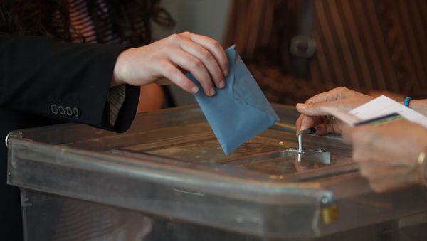 This illustration picture taken on May 26, 2019 shows a person casting her vote for the European elections at a polling station in Strasbourg, eastern France. This illustration picture taken on May 26, 2019 shows a person casting her vote for the European elections at a polling station in Strasbourg, eastern France. - Sputnik International