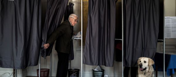 A person is seen in a polling booth during the vote for the European parliament elections, on May 26, 2019 in Le Puy-en-Velay. A person is seen in a polling booth during the vote for the European parliament elections, on May 26, 2019 in Le Puy-en-Velay. - Sputnik International