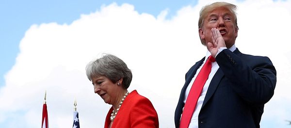 Britain's Prime Minister Theresa May and U.S. President Donald Trump walk after holding a joint news conference at Chequers, the official country residence of the Prime Minister, near Aylesbury, Britain, July 13, 2018 Britain's Prime Minister Theresa May and U.S. President Donald Trump walk after holding a joint news conference at Chequers, the official country residence of the Prime Minister, near Aylesbury, Britain, July 13, 2018 - Sputnik International