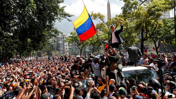 Venezuelan opposition leader Juan Guaido, who many nations have recognised as the country's rightful interim ruler, gestures after talking to supporters in Caracas, Venezuela April 30, 2019 - Sputnik International