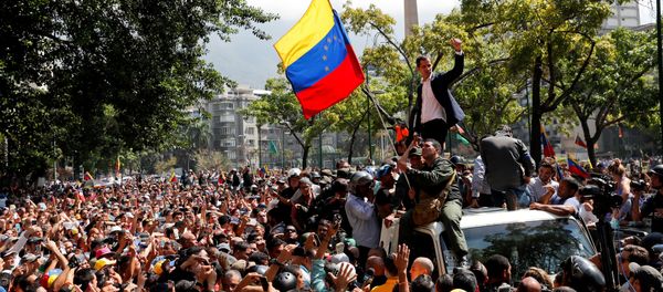 Venezuelan opposition leader Juan Guaido, who many nations have recognised as the country's rightful interim ruler, gestures after talking to supporters in Caracas, Venezuela April 30, 2019 Venezuelan opposition leader Juan Guaido, who many nations have recognised as the country's rightful interim ruler, gestures after talking to supporters in Caracas, Venezuela April 30, 2019 - Sputnik International