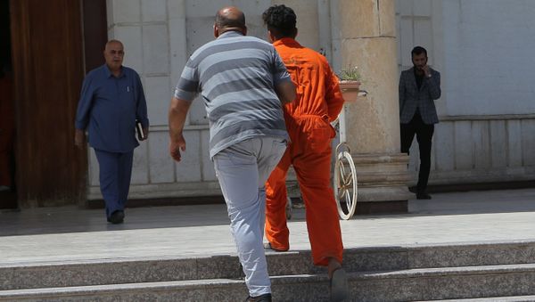 In this Sunday, May 5, 2019 photo, an IS suspect wearing a red prison suit, center right, being led to the Iraqi Criminal Court in Baghdad's Karkh district, Iraq In this Sunday, May 5, 2019 photo, an IS suspect wearing a red prison suit, center right, being led to the Iraqi Criminal Court in Baghdad's Karkh district, Iraq - Sputnik International