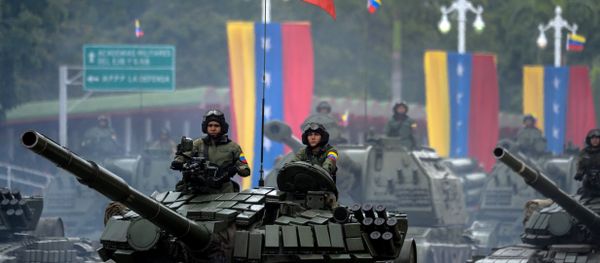 Venezuelan Russian-made Mi-17 helicopters overfly a column of T-72B tanks during a military parade to celebrate Venezuela's 206th anniversary of iIndependence in Caracas on July 5, 2017 Venezuelan Russian-made Mi-17 helicopters overfly a column of T-72B tanks during a military parade to celebrate Venezuela's 206th anniversary of iIndependence in Caracas on July 5, 2017 - Sputnik International