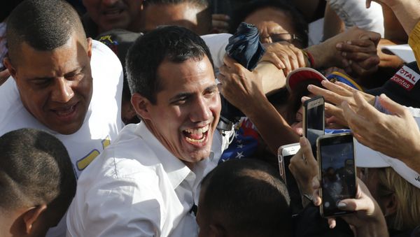 Venezuela's opposition leader and self-proclaimed interim president Juan Guaido greets supporters during a rally in Barinas, Venezuela, Saturday, June 1, 2019. Guaido is taking his campaign to oust President Nicolas Maduro to the birthplace of Hugo Chavez, the socialist leaders's mentor Venezuela's opposition leader and self-proclaimed interim president Juan Guaido greets supporters during a rally in Barinas, Venezuela, Saturday, June 1, 2019. Guaido is taking his campaign to oust President Nicolas Maduro to the birthplace of Hugo Chavez, the socialist leaders's mentor - Sputnik International