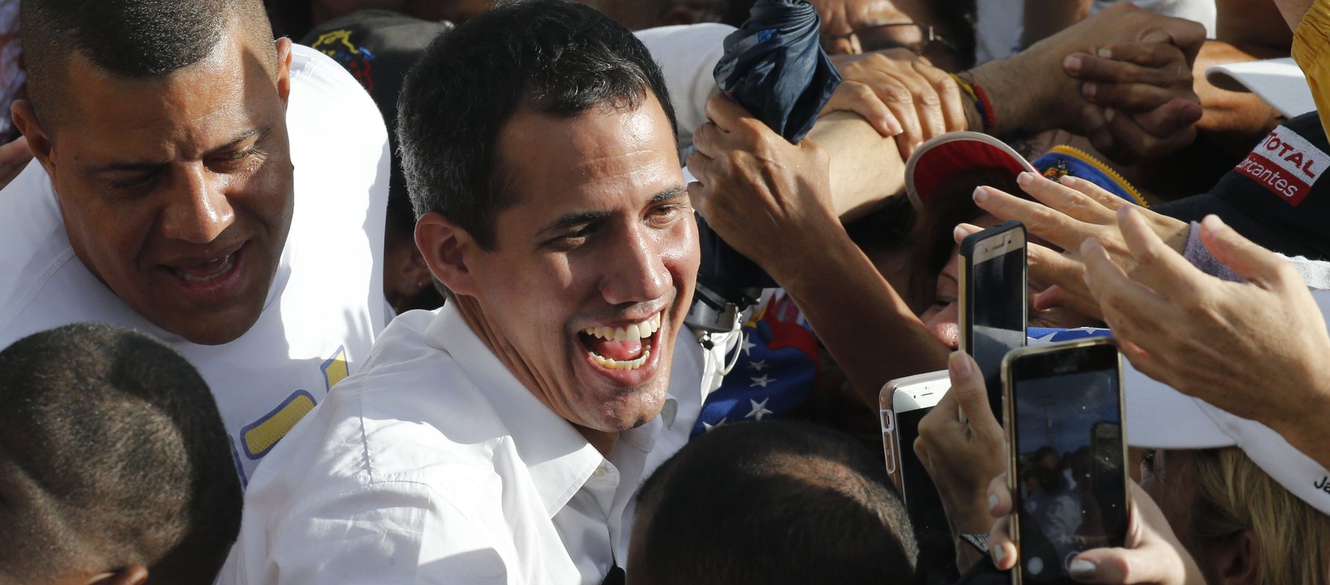 Venezuela's opposition leader and self-proclaimed interim president Juan Guaido greets supporters during a rally in Barinas, Venezuela, Saturday, June 1, 2019. Guaido is taking his campaign to oust President Nicolas Maduro to the birthplace of Hugo Chavez, the socialist leaders's mentor Venezuela's opposition leader and self-proclaimed interim president Juan Guaido greets supporters during a rally in Barinas, Venezuela, Saturday, June 1, 2019. Guaido is taking his campaign to oust President Nicolas Maduro to the birthplace of Hugo Chavez, the socialist leaders's mentor - Sputnik International, 1920, 25.01.2021
