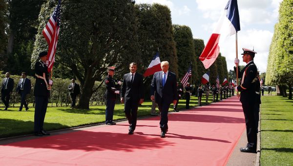 President Donald Trump and French President Emmanuel Macron, arrive to a ceremony to commemorate the 75th anniversary of D-Day at The Normandy American Cemetery, Thursday, June 6, 2019, in Colleville-sur-Mer, Normandy, France President Donald Trump and French President Emmanuel Macron, arrive to a ceremony to commemorate the 75th anniversary of D-Day at The Normandy American Cemetery, Thursday, June 6, 2019, in Colleville-sur-Mer, Normandy, France - Sputnik International