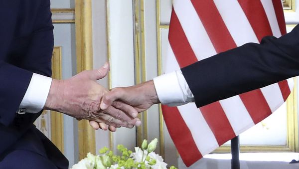 U.S President Donald Trump, left, shakes hands with French President Emmanuel Macron at the Prefecture of Caen, Normandy, France, Thursday, June 6, 2019. World leaders are gathered Thursday in France to mark the 75th anniversary of the D-Day landings. (Ludovic Marin/POOL via AP) - Sputnik International