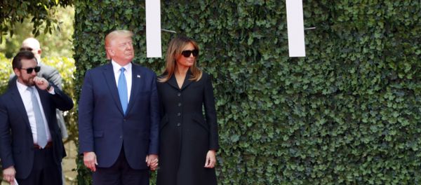 U.S. President Donald Trump and first lady Melania Trump arrive for a ceremony to mark the 75th anniversary of D-Day at the Normandy American Cemetery in Colleville-sur-Mer, Normandy, France, Thursday, June 6, 2019. World leaders are gathered Thursday in France to mark the 75th anniversary of the D-Day landings. (AP Photo/Thibault Camus) - Sputnik International
