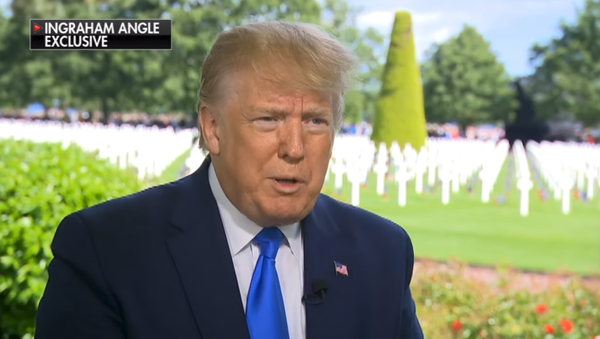 US President Donald Trump speaks to Fox News' Laura Ingraham in front of a cemetery of US war dead in Normandy, France - Sputnik International