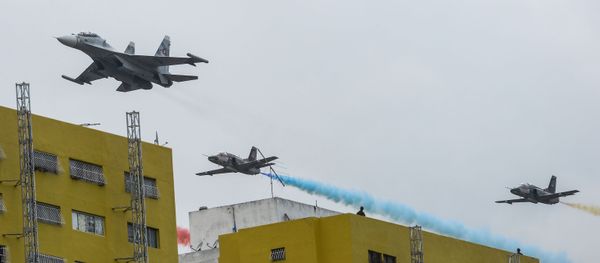 A Russian-made Venezuelan Air Force Sukhoi Su-30MKV multirole strike fighter followed by a Chinese-made Hongdu K-8 Karakorum trainer overfly the parade during the celebration of Venezuela's Independence Day in Caracas on July 5, 2015 A Russian-made Venezuelan Air Force Sukhoi Su-30MKV multirole strike fighter followed by a Chinese-made Hongdu K-8 Karakorum trainer overfly the parade during the celebration of Venezuela's Independence Day in Caracas on July 5, 2015 - Sputnik International