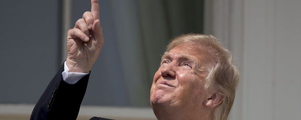 President Donald Trump points to the sun as he arrives to view the solar eclipse, Monday, Aug. 21, 2017, at the White House in Washington. President Donald Trump points to the sun as he arrives to view the solar eclipse, Monday, Aug. 21, 2017, at the White House in Washington. - Sputnik International
