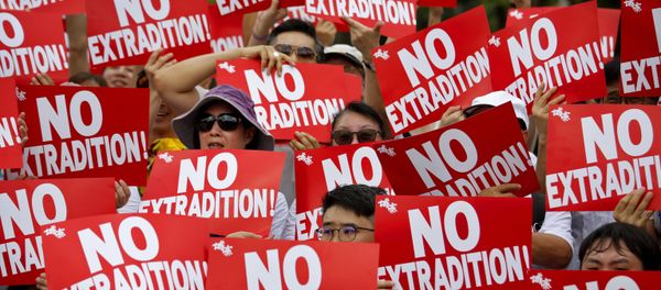 Protesters hold placards as they stage protest against the extradition law in Hong Kong, Sunday, June 9, 2019 Protesters hold placards as they stage protest against the extradition law in Hong Kong, Sunday, June 9, 2019 - Sputnik International
