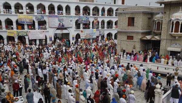 Sikh pilgrims pray during the Vasakhi festival, at the shrine of Gurdwara Punja Sahib, the second most sacred place for Sikhs, in Hasan Abdal, some 50 kilometers (31 Miles) from Islamabad, Pakistan, Sunday, April 14, 2019.  - Sputnik International