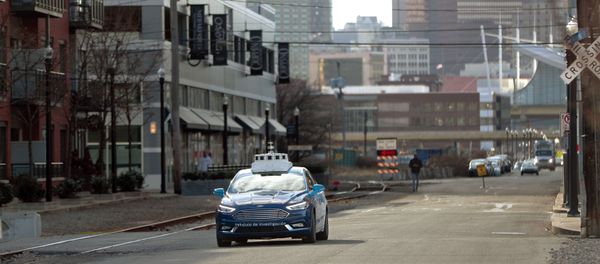 In this Dec. 18, 2018, photo one of the test vehicles from Argo AI, Ford's autonomous vehicle unit, navigates through the strip district near the company offices in Pittsburgh In this Dec. 18, 2018, photo one of the test vehicles from Argo AI, Ford's autonomous vehicle unit, navigates through the strip district near the company offices in Pittsburgh - Sputnik International