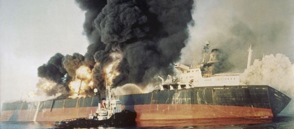 The Singapore registered tanker Norman Atlantic sits ablaze in the Straits of Hormuz on Dec. 6, 1987, after being attacked by an Iranian gunboat. The 86,129 ton tanker was carrying a cargo of naphtha liquid gas from Kuwait. All 22 crewmen left the ship and no injuries were reported. The Singapore registered tanker Norman Atlantic sits ablaze in the Straits of Hormuz on Dec. 6, 1987, after being attacked by an Iranian gunboat. The 86,129 ton tanker was carrying a cargo of naphtha liquid gas from Kuwait. All 22 crewmen left the ship and no injuries were reported. - Sputnik International