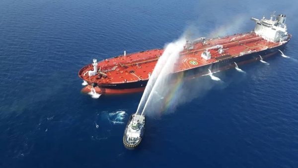 An Iranian navy boat tries to stop the fire of an oil tanker after it was attacked in the Gulf of Oman, June 13, 2019 An Iranian navy boat tries to stop the fire of an oil tanker after it was attacked in the Gulf of Oman, June 13, 2019 - Sputnik International