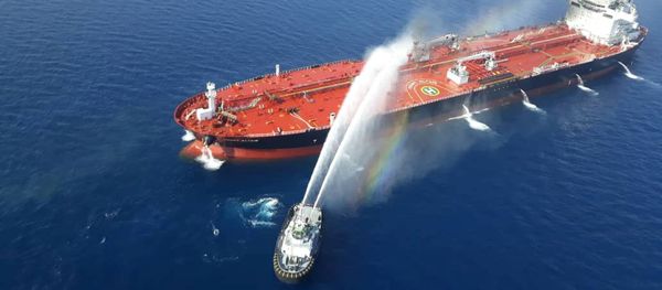 An Iranian navy boat tries to stop the fire of an oil tanker after it was attacked in the Gulf of Oman, June 13, 2019 An Iranian navy boat tries to stop the fire of an oil tanker after it was attacked in the Gulf of Oman, June 13, 2019 - Sputnik International