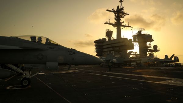 The sun sets behind the U.S. Navy aircraft carrier USS Abraham Lincoln, in Arabian Sea, June 3, 2019. Picture taken June 3, 2019 The sun sets behind the U.S. Navy aircraft carrier USS Abraham Lincoln, in Arabian Sea, June 3, 2019. Picture taken June 3, 2019 - Sputnik International
