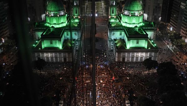 Candelaria church is reflected in a building's windows, left, where people protest government-proposed pension reforms during a strike in Rio de Janeiro, Brazil, Friday, June 14, 2019. - Sputnik International