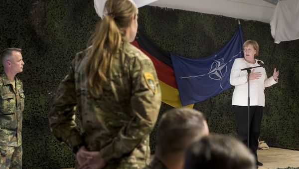 German Chancellor Angela Merkel delivers her speech during a meeting with German Bundeswehr soldiers of the NATO enhanced forward presence battalion at the Rukla military base - Sputnik International
