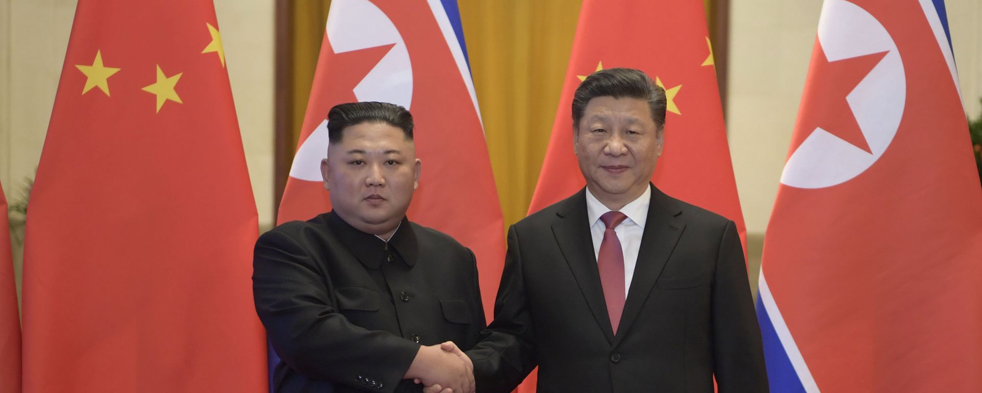 In this Tuesday, Jan. 8, 2019, photo released by China's Xinhua News Agency, North Korean leader Kim Jong-un, left, and Chinese President Xi Jinping shake hands as they pose for a photo before talks at the Great Hall of the People in Beijing. In this Tuesday, Jan. 8, 2019, photo released by China's Xinhua News Agency, North Korean leader Kim Jong-un, left, and Chinese President Xi Jinping shake hands as they pose for a photo before talks at the Great Hall of the People in Beijing. - Sputnik International, 1920, 23.02.2026