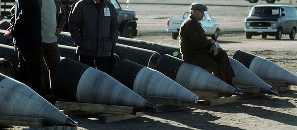 Soviet inspectors and their American escorts stand among several dismantled Pershing II missiles as they view the destruction of other missile components Soviet inspectors and their American escorts stand among several dismantled Pershing II missiles as they view the destruction of other missile components - Sputnik International