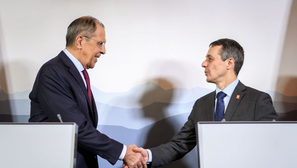 Russian Foreign Minister Sergei Lavrov (L) shakes hands with Swiss Foreign Minister Ignazio Cassis  - Sputnik International