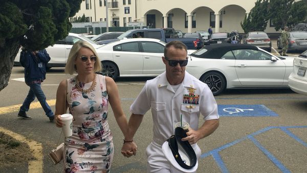 Navy Special Operations Chief Edward Gallagher, right, walks with his wife, Andrea Gallagher, as they arrive to military court on Naval Base San Diego, Thursday, June 20, 2019, in San Diego.  - Sputnik International