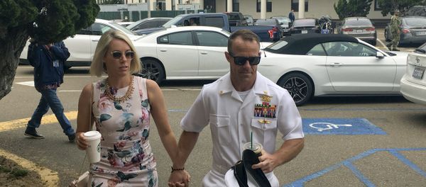 Navy Special Operations Chief Edward Gallagher, right, walks with his wife, Andrea Gallagher, as they arrive to military court on Naval Base San Diego, Thursday, June 20, 2019, in San Diego.  - Sputnik International