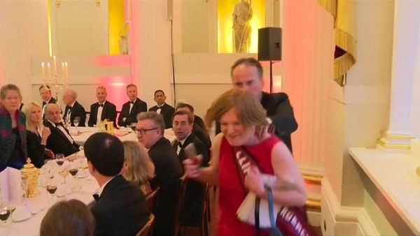A screenshot of the video of Mark Field appearing to grab a female protester by her neck and haul her away - Sputnik International
