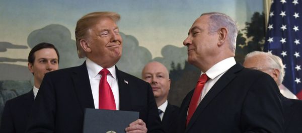 In this Monday, March 25, 2019 file photo, President Donald Trump smiles at Israeli Prime Minister Benjamin Netanyahu, right, after signing a proclamation in the Diplomatic Reception Room at the White House in Washington In this Monday, March 25, 2019 file photo, President Donald Trump smiles at Israeli Prime Minister Benjamin Netanyahu, right, after signing a proclamation in the Diplomatic Reception Room at the White House in Washington - Sputnik International