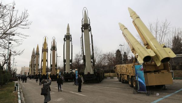 Iranians visit a weaponry and military equipment exhibition in the capital Tehran on Febraury 2, 2019, organised on the occasion of the 40th anniversary of the Isranian revolution - Sputnik International