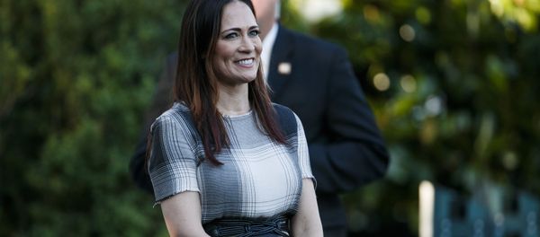Stephanie Grisham, spokeswoman for first lady Melania Trump, watches as President Donald Trump and the first lady greet attendees during the annual Congressional Picnic on the South Lawn, Friday, June 21, 2019, in Washington.  - Sputnik International