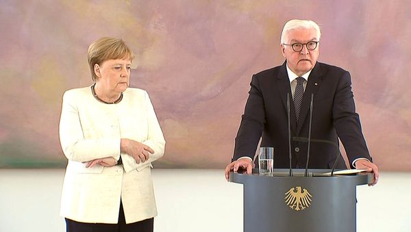 German Chancellor Angela Merkel was seen shaking as she met President Frank-Walter Steinmeier in Berlin, Germany, June 27, 2019, her second shaking bout within two weeks - Sputnik International