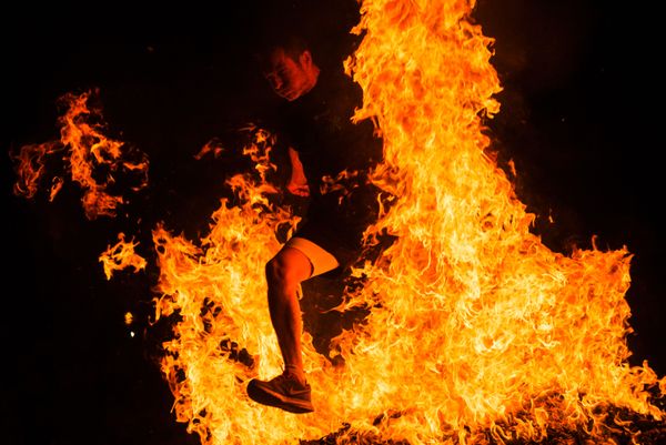 A Man Jumps Over a Bonfire in Spain on Saint John's Eve A Man Jumps Over a Bonfire in Spain on Saint John's Eve - Sputnik International