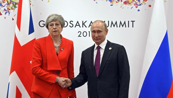 June 28, 2019. The Russian President Vladimir Putin and the prime minister of Great Britain Theresa May during the meeting on the sidelines of the summit in Osaka June 28, 2019. The Russian President Vladimir Putin and the prime minister of Great Britain Theresa May during the meeting on the sidelines of the summit in Osaka - Sputnik International
