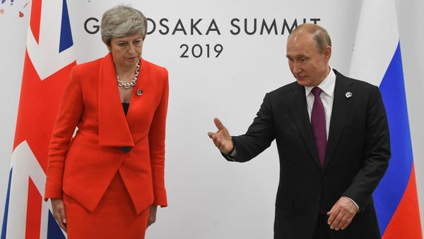 British Prime Minister Theresa May and Russian President Vladimir Putin take their seats during a meeting on the sidelines of the Group of 20 (G20) leaders summit in Osaka, Japan British Prime Minister Theresa May and Russian President Vladimir Putin take their seats during a meeting on the sidelines of the Group of 20 (G20) leaders summit in Osaka, Japan - Sputnik International