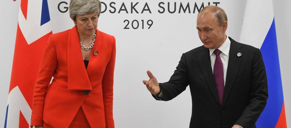 British Prime Minister Theresa May and Russian President Vladimir Putin take their seats during a meeting on the sidelines of the Group of 20 (G20) leaders summit in Osaka, Japan British Prime Minister Theresa May and Russian President Vladimir Putin take their seats during a meeting on the sidelines of the Group of 20 (G20) leaders summit in Osaka, Japan - Sputnik International