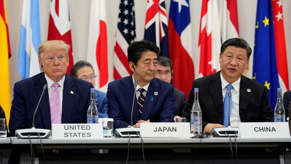 Japan's Prime Minister Shinzo Abe is flanked by U.S. President Donald Trump and China's President Xi Jinping during a meeting at the G20 leaders summit in Osaka, Japan, June 28, 2019 Japan's Prime Minister Shinzo Abe is flanked by U.S. President Donald Trump and China's President Xi Jinping during a meeting at the G20 leaders summit in Osaka, Japan, June 28, 2019 - Sputnik International