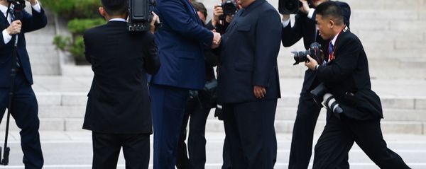North Korea's leader Kim Jong Un shakes hands with US President Donald Trump north of the Military Demarcation Line that divides North and South Korea, in the Joint Security Area (JSA) of Panmunjom in the Demilitarized zone (DMZ) on June 30, 2019.  - Sputnik International