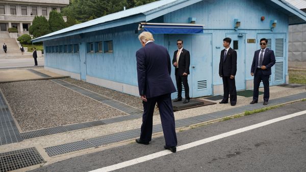 U.S. President Donald Trump walks to meet with North Korean leader Kim Jong Un at the demilitarized zone separating the two Koreas, in Panmunjom, South Korea, June 30, 2019.  - Sputnik International