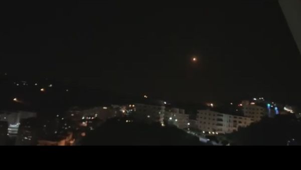 Snap from the video posted by SANA pictiring explosions over Damascus - Sputnik International