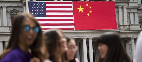 In this Thursday, Sept. 24, 2015, photo, China's flag is displayed next to the American flag on the side of the Old Executive Office Building on the White House complex in Washington, the day before a state visit by Chinese President Xi Jinping In this Thursday, Sept. 24, 2015, photo, China's flag is displayed next to the American flag on the side of the Old Executive Office Building on the White House complex in Washington, the day before a state visit by Chinese President Xi Jinping - Sputnik International