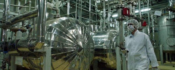 An Iranian security official, dressed in protective clothing, walks inside the Uranium Conversion Facility, just outside the city of Isfahan, 410 kilometers, (255 miles), south of the Iranian capital Tehran in this Wednesday, March 30, 2005 An Iranian security official, dressed in protective clothing, walks inside the Uranium Conversion Facility, just outside the city of Isfahan, 410 kilometers, (255 miles), south of the Iranian capital Tehran in this Wednesday, March 30, 2005 - Sputnik International